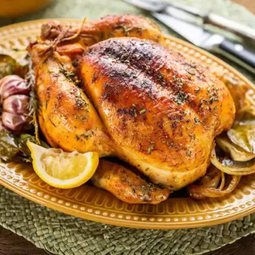 Frango assado com limão-siciliano e ervas