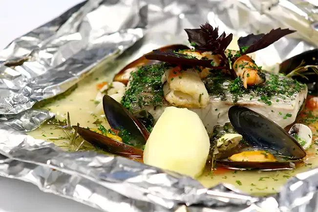 Receita de Papilote de robalo e crustáceos à provençal